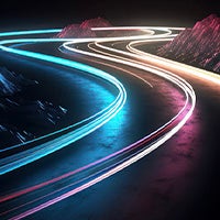 Neon time-lapsed car lights on a road at night